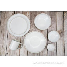 Reactive glazed stoneware dinner set in Creamy white